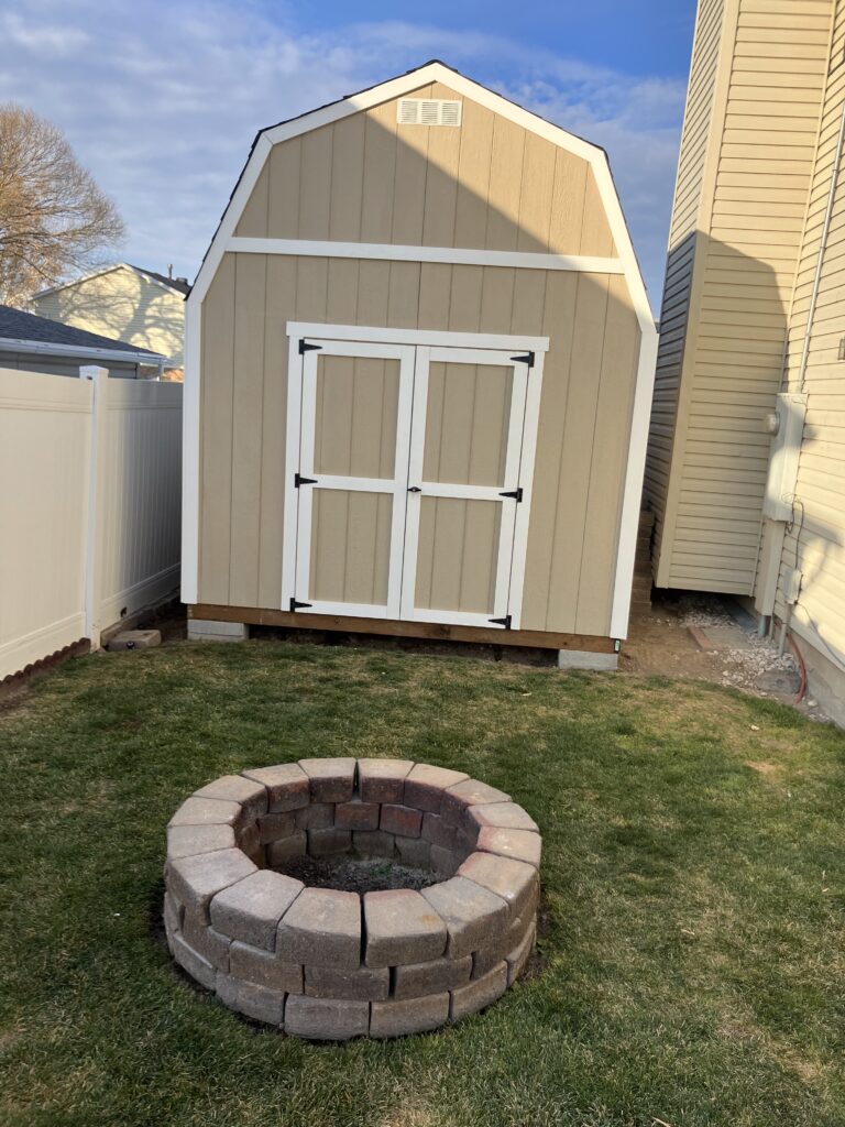 Backyard storage shed built by shed builder in Draper, UT with custom design features